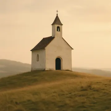 Jigsaw puzzle: A quaint white chapel with a bell tower stands on a golden grassy hill.